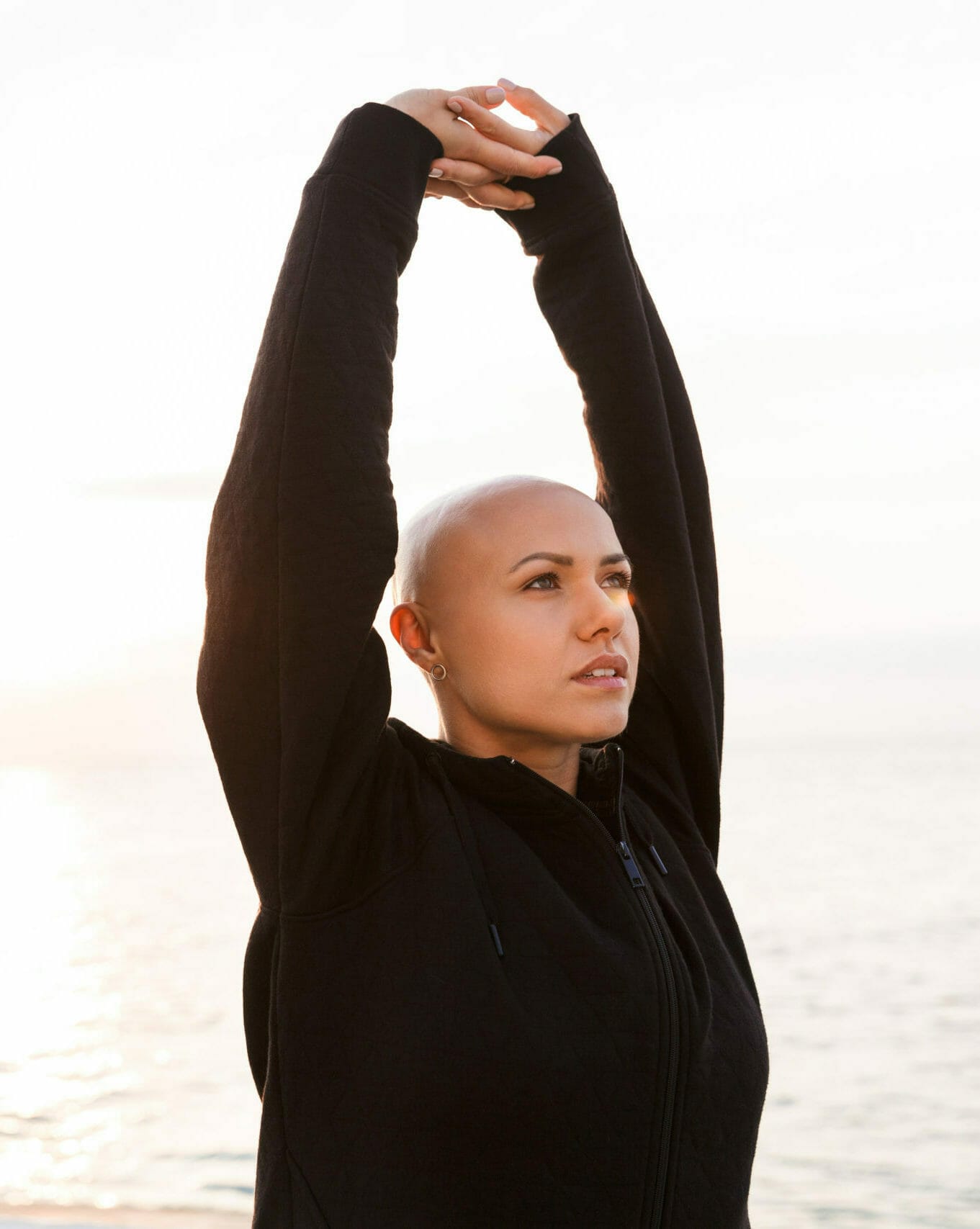 A woman stretching and empowered by Organizations That Help Cancer Patients Financially